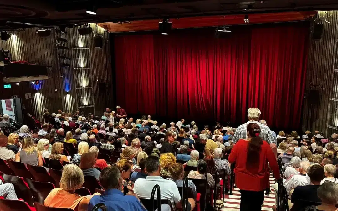 an audience in the Yvonne Arnaud Theatre
